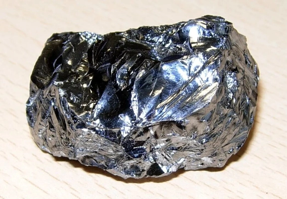 Crystalline silicon element sample showing metallic luster — a typical metalloid with both metallic and nonmetallic properties